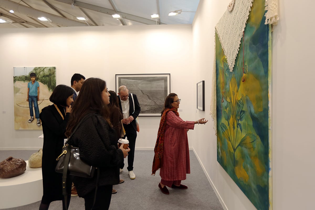Visitors engaging with contemporary art at an Indian art fair