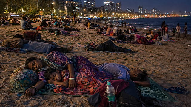 Mumbai Heatwave: Residents Sleep on Versova Beach to Escape Sweltering Homes Mumbai Heatwave: Residents Sleep on Versova Beach to Escape Sweltering Homes