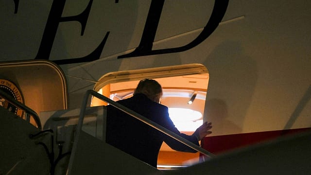 Donald Trump boards Air Force One to attend the NATO Summit in Ankara, Turkey. Donald Trump boards Air Force One to attend the NATO Summit in Ankara, Turkey.