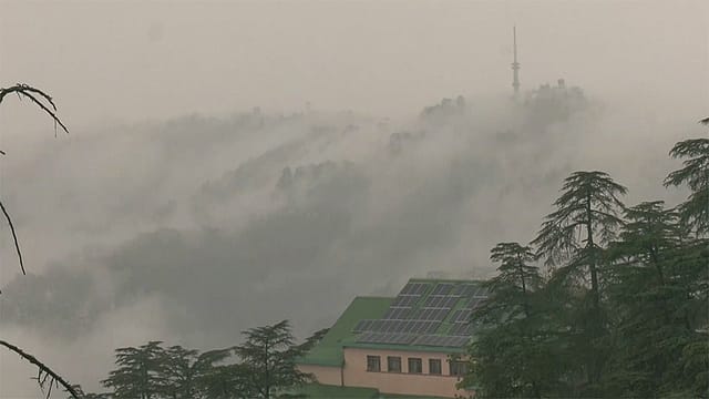 Grey clouds engulf the area as rain lashes parts of the city, in Shimla on Thursday. Grey clouds engulf the area as rain lashes parts of the city, in Shimla on Thursday.
