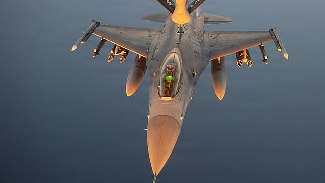 A KC-135 Stratotanker refuels U.S. Air Force F-16 fighter jets while flying a patrol over the Middle East. A KC-135 Stratotanker refuels U.S. Air Force F-16 fighter jets while flying a patrol over the Middle East.