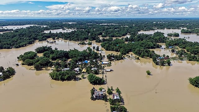 An aerial view shows vast areas submerged as floodwaters inundate villages and homes in Assam's Sivasagar district An aerial view shows vast areas submerged as floodwaters inundate villages and homes in Assam's Sivasagar district
