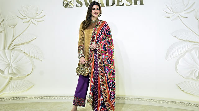 Bollywood actress Kriti Sanon poses for a picture during the one-year celebration of Swadesh on the eve of Navratri at Eros, in Mumbai on Saturday. Bollywood actress Kriti Sanon poses for a picture during the one-year celebration of Swadesh on the eve of Navratri at Eros, in Mumbai on Saturday.