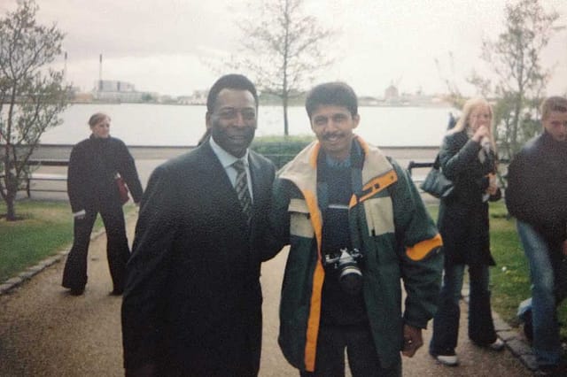 Pele put his arm around me and asked his assistant to take a photo